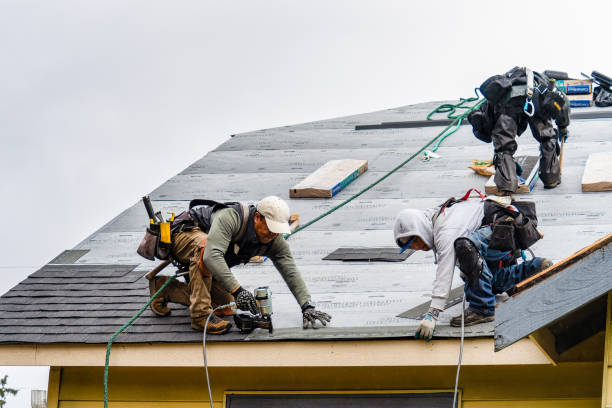 Professional Roofing technician working in Kingsley, IA